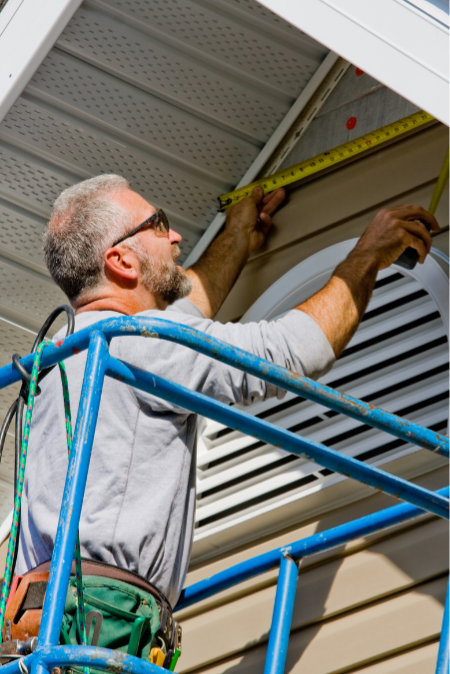 diy pest control - man sealing gable